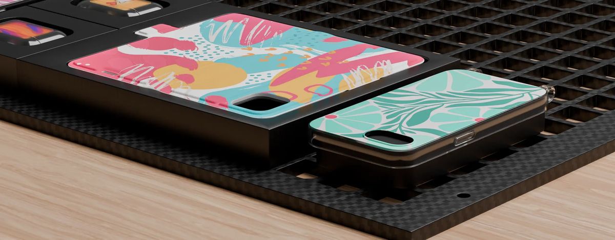Phone cases being printed in a batch at Printeers
