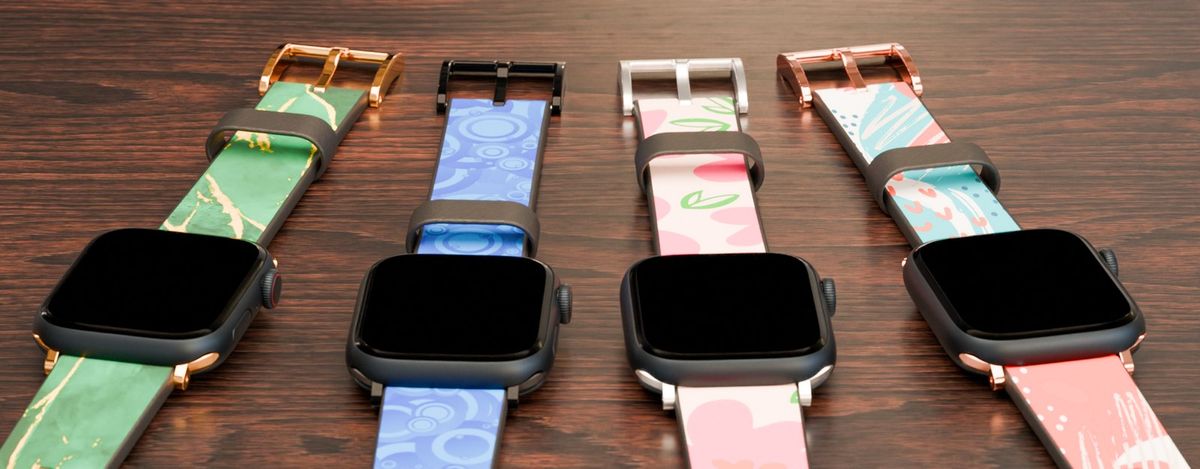 Four printed Apple Watch bands, each with a different clasp and connector finish
