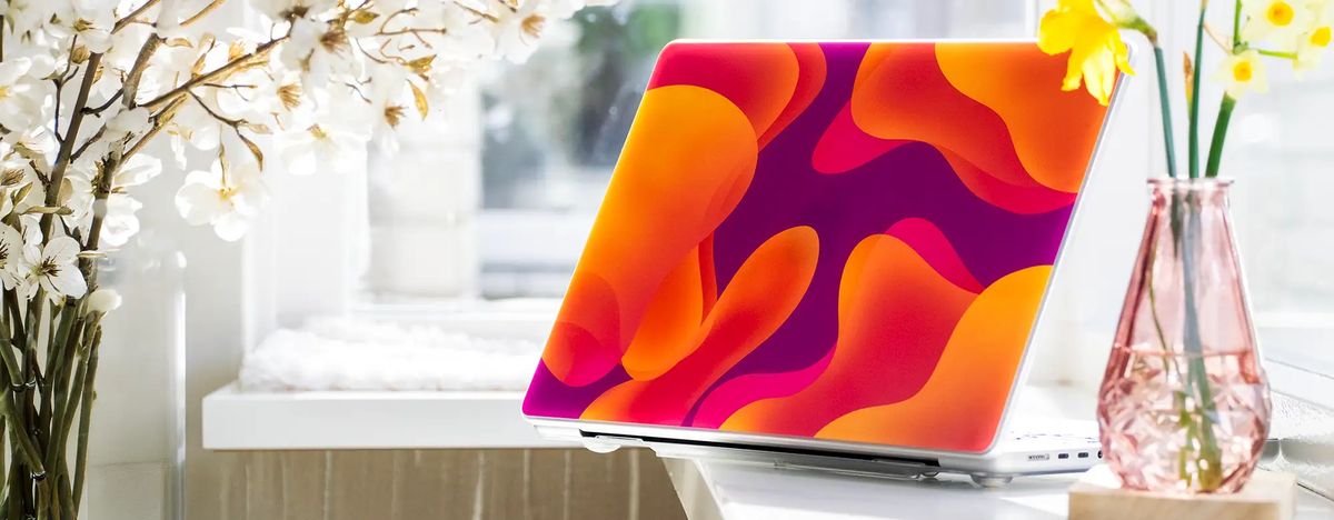 A custom MacBook case in everyday use
